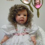 Dolls That Look Like Your Child Dressed in White Ruffles